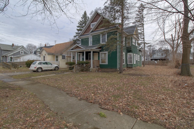 view of front facade with a porch and a residential view