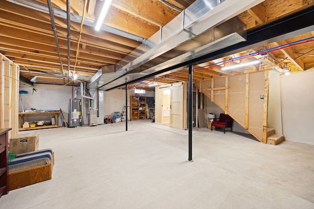 unfinished basement featuring heating unit, stairs, and water heater