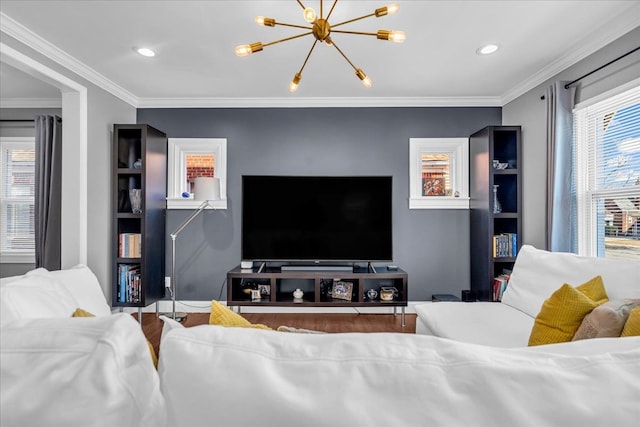 living area with recessed lighting, wood finished floors, an inviting chandelier, and ornamental molding