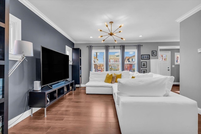 living area with dark wood finished floors, crown molding, baseboards, and a chandelier