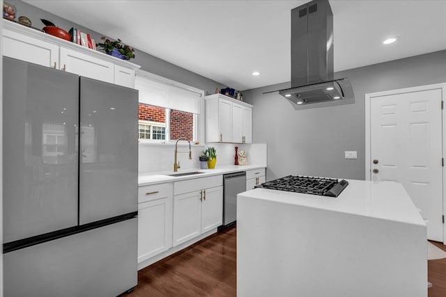 kitchen with a sink, island exhaust hood, dark wood-style flooring, and stainless steel appliances