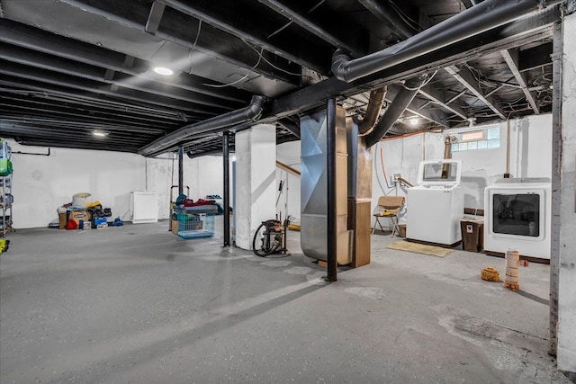 basement featuring washing machine and clothes dryer