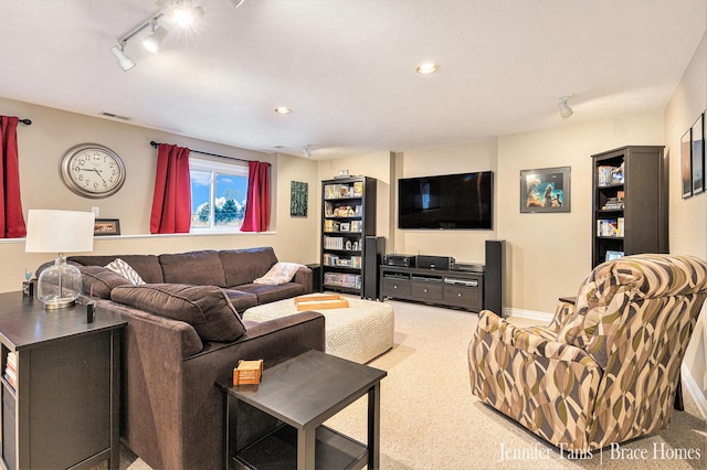 carpeted living room with baseboards, track lighting, visible vents, and recessed lighting