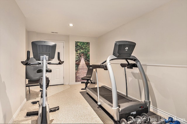 exercise area with recessed lighting and baseboards