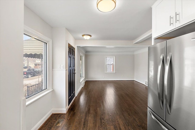 interior space featuring dark wood-style floors and baseboards