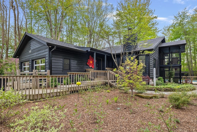 view of front facade featuring a wooden deck