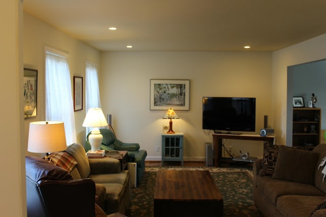 living room with wood finished floors, recessed lighting, and baseboards