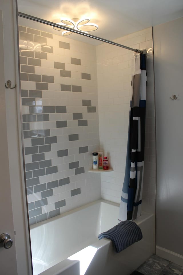 bathroom featuring shower / bathtub combination with curtain