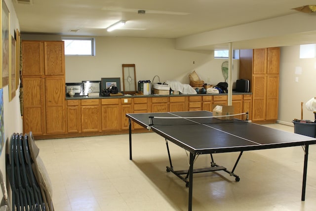 recreation room featuring visible vents and light floors