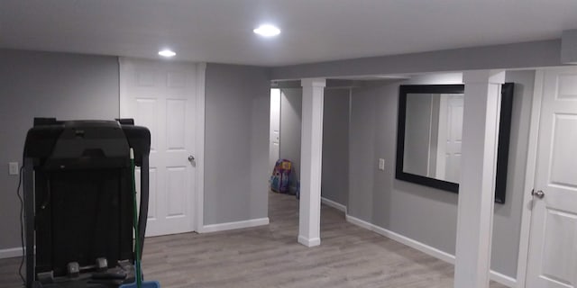 workout area with recessed lighting, light wood-style flooring, and baseboards