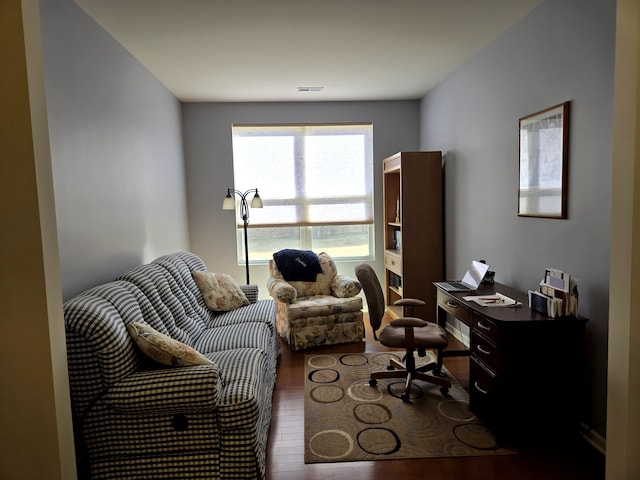 office space with visible vents and wood finished floors