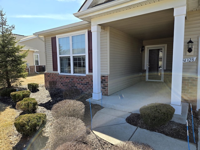 entrance to property with brick siding