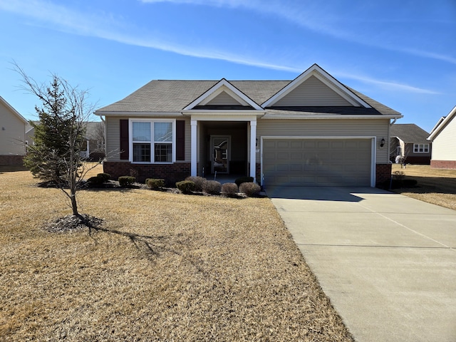 view of front facade featuring concrete driveway, brick siding, and an attached garage