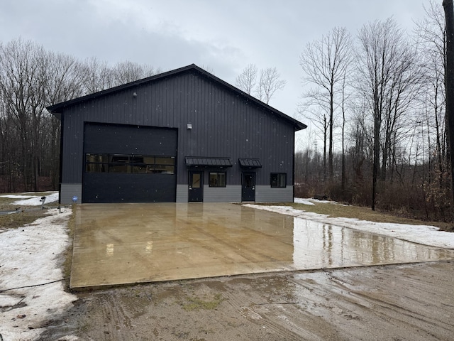 view of property exterior with an outbuilding and a garage