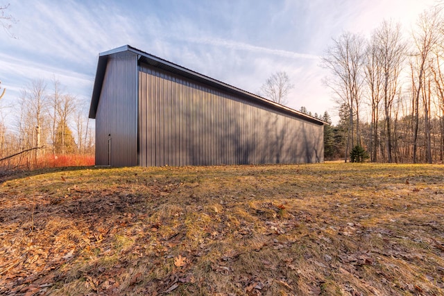 view of home's exterior featuring an outbuilding and an outdoor structure