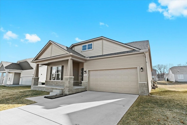 craftsman inspired home featuring a front yard, covered porch, concrete driveway, a garage, and stone siding