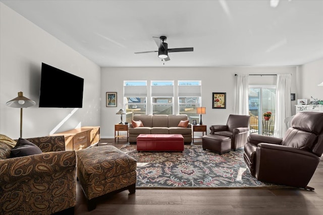 living area with wood finished floors and ceiling fan