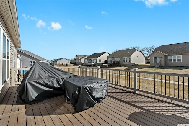 wooden deck with a residential view