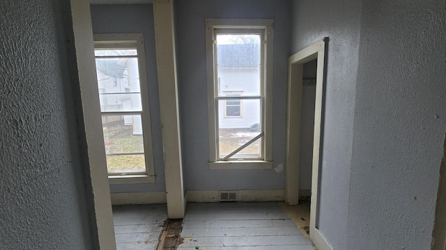 77 Irwin Ave, Muskegon, MI 49442 - hall with visible vents and a textured wall