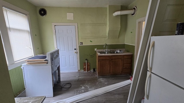 77 Irwin Ave, Muskegon, MI 49442 - kitchen featuring a sink, a healthy amount of sunlight, light countertops, and freestanding refrigerator