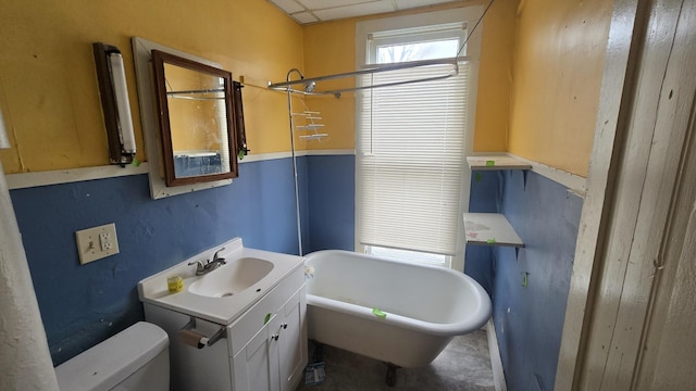 77 Irwin Ave, Muskegon, MI 49442 - full bath featuring vanity, a freestanding tub, and toilet