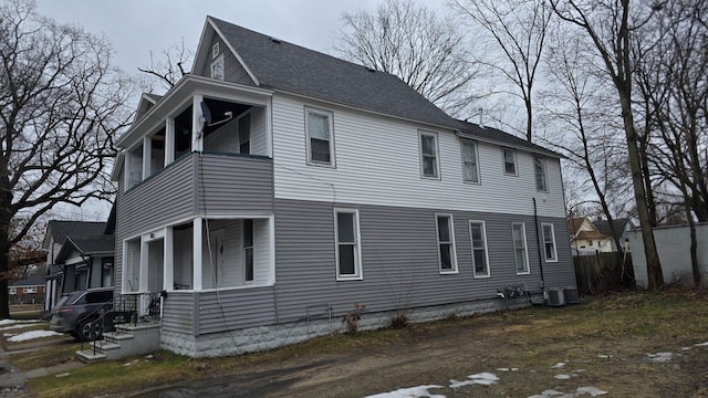 77 Irwin Ave, Muskegon, MI 49442 - view of home's exterior with a balcony and a shingled roof