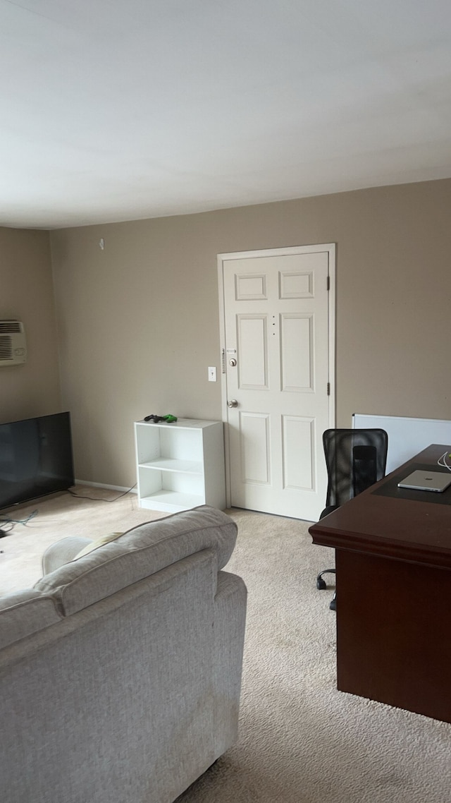 interior space featuring carpet and a wall mounted air conditioner