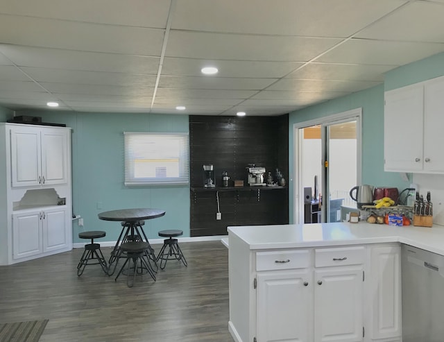 kitchen featuring white cabinetry, dark wood finished floors, and dishwasher