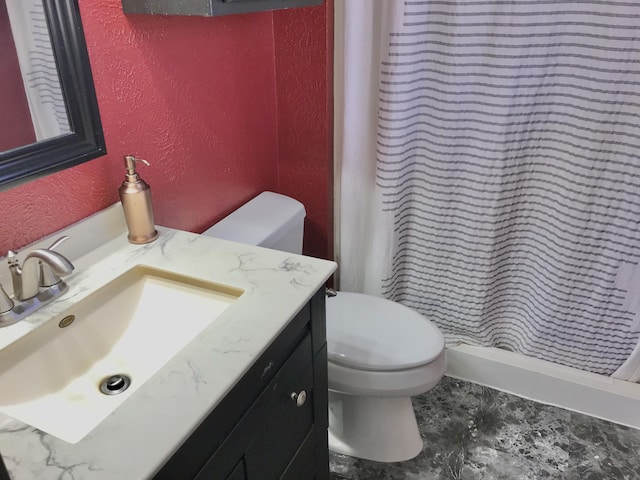 full bathroom featuring toilet, curtained shower, vanity, and a textured wall