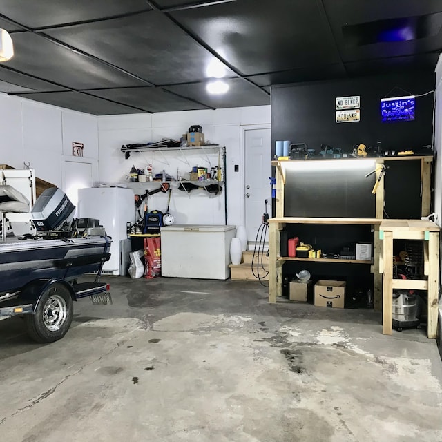 garage with freestanding refrigerator