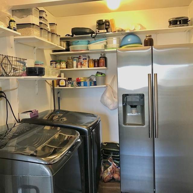 laundry room with washer and dryer and laundry area