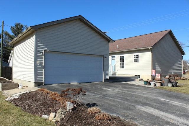 view of side of home featuring a garage