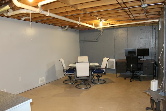 unfinished basement with visible vents and baseboards