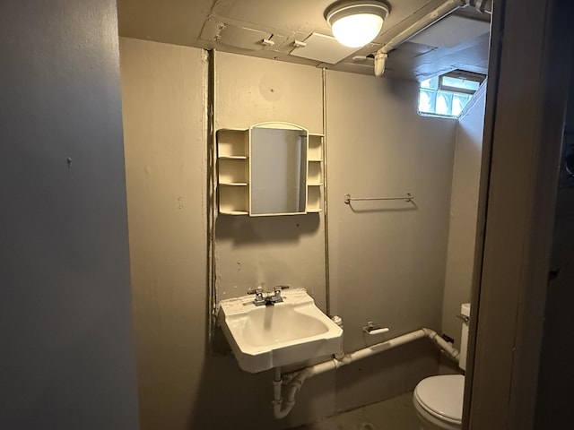 half bathroom with a sink and toilet