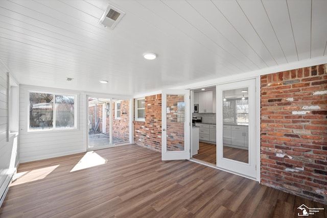 unfurnished sunroom with visible vents