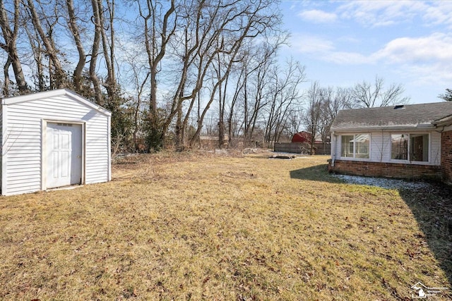 view of yard with a storage shed and an outdoor structure