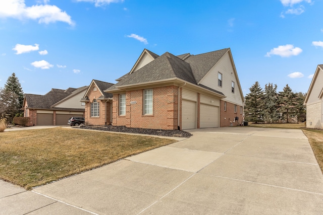 view of front of home featuring brick siding, a shingled roof, concrete driveway, a front yard, and a garage