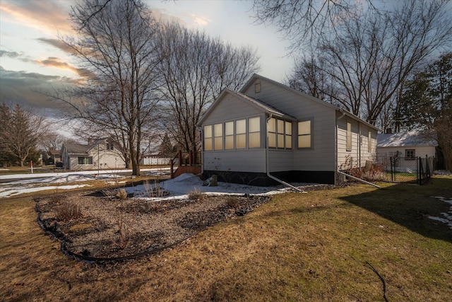 exterior space featuring a yard and fence