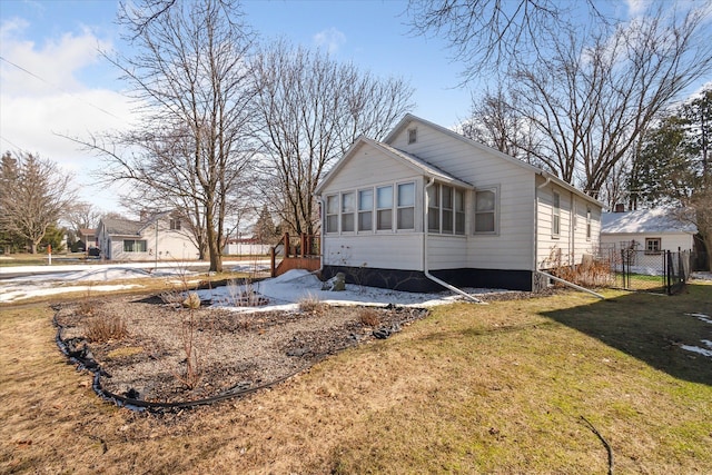 view of front of property with a front yard and fence