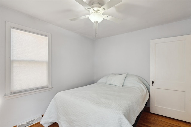 bedroom featuring a ceiling fan and wood finished floors