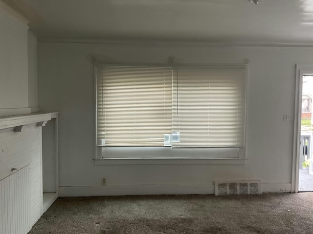 unfurnished dining area with carpet floors and visible vents