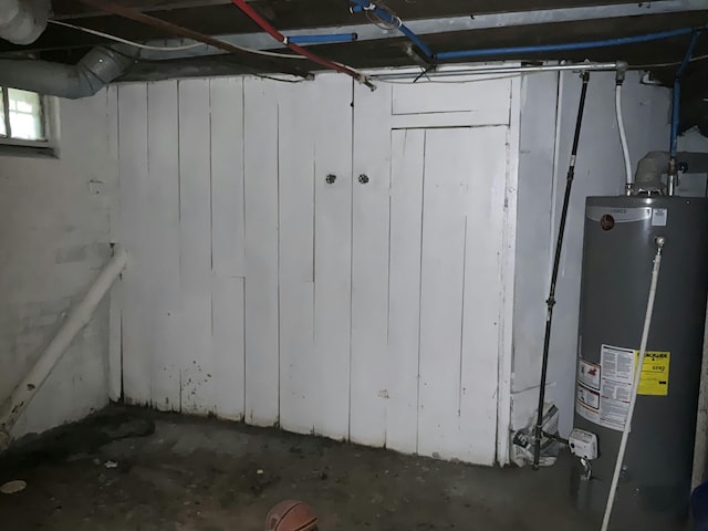 below grade area featuring water heater