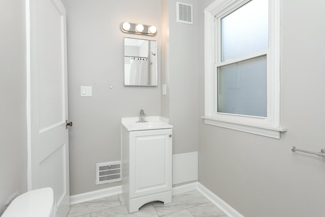 full bathroom with marble finish floor, visible vents, and baseboards