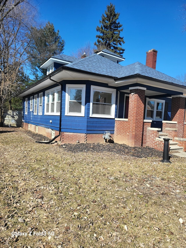 view of property exterior with a chimney