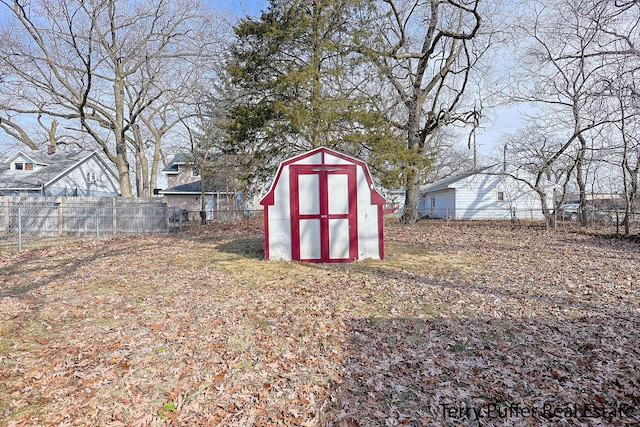 view of shed with a fenced backyard