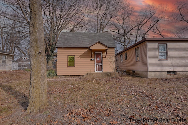 view of front of house featuring fence