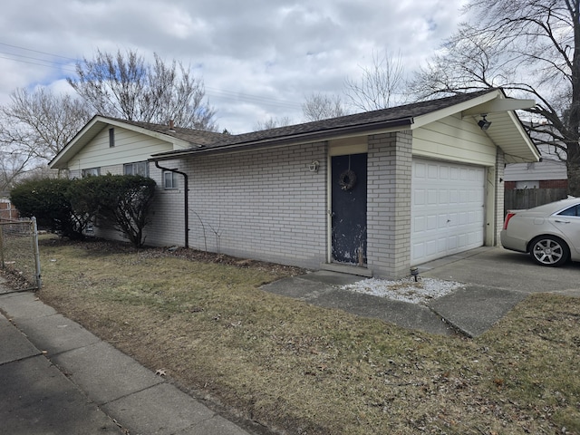 exterior space with brick siding, roof with shingles, and fence