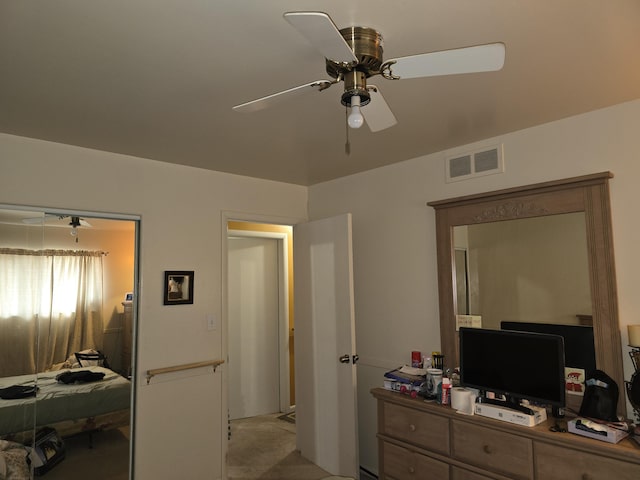 bedroom with ceiling fan and visible vents