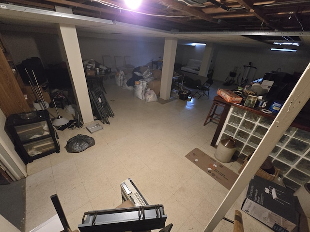 unfinished basement with tile patterned floors