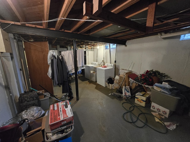 unfinished below grade area featuring washer and clothes dryer